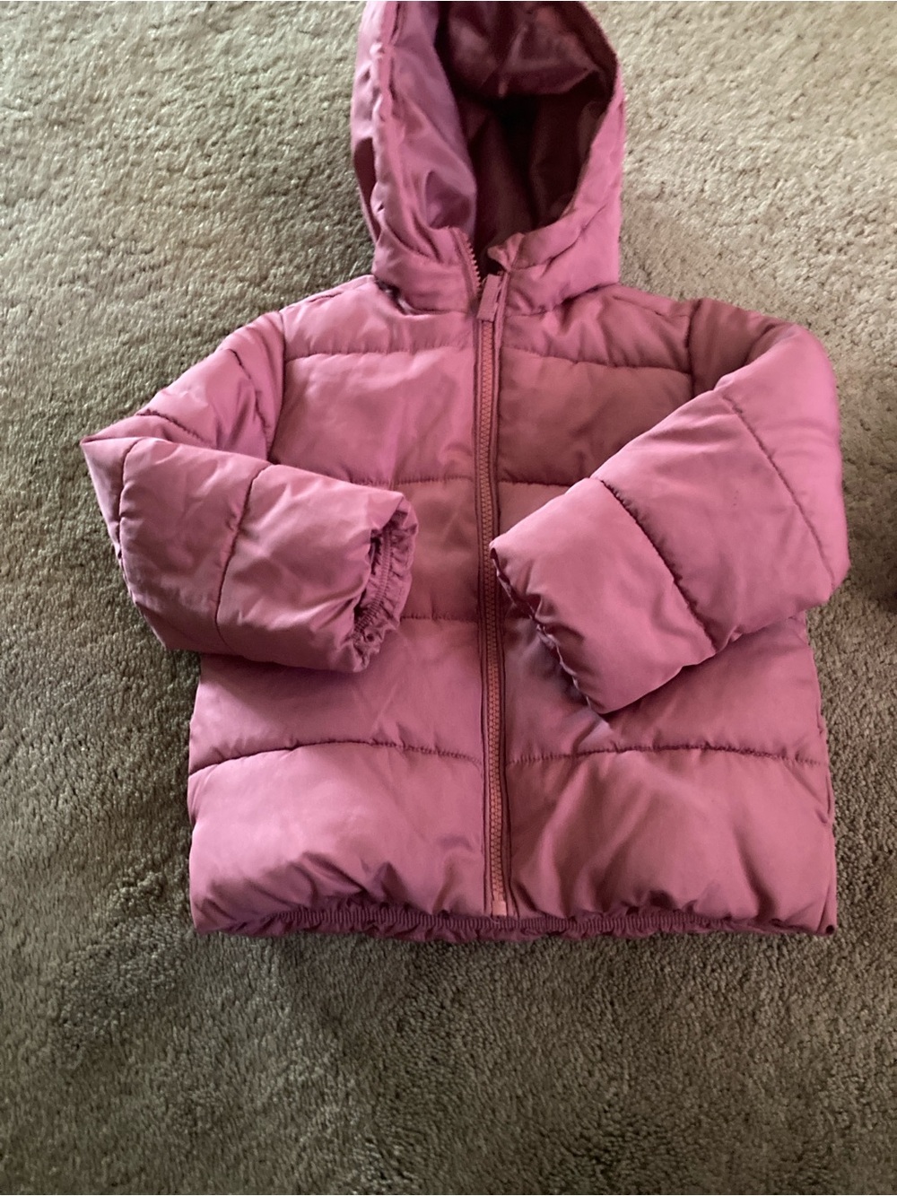 Children place jacket and mittens